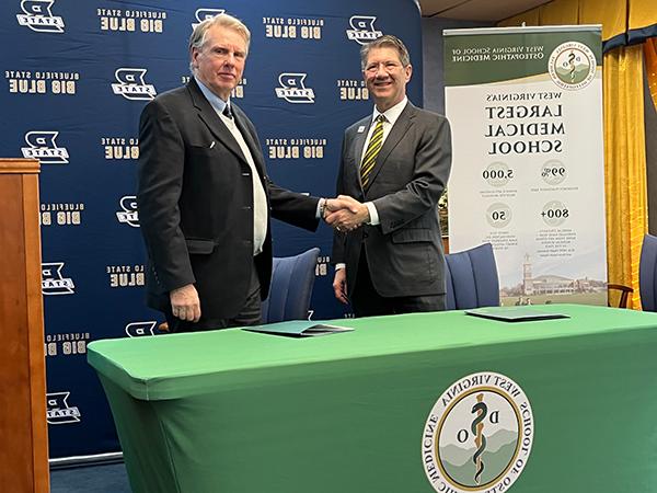 West Virginia School of Osteopathic Medicine President James Nemitz (left) and Bluefield State University President Robin Capehart are pictured moments after signing a memorandum of understanding focused on more thoroughly preparing BSU students aspiring to pursue a career in osteopathic medicine.